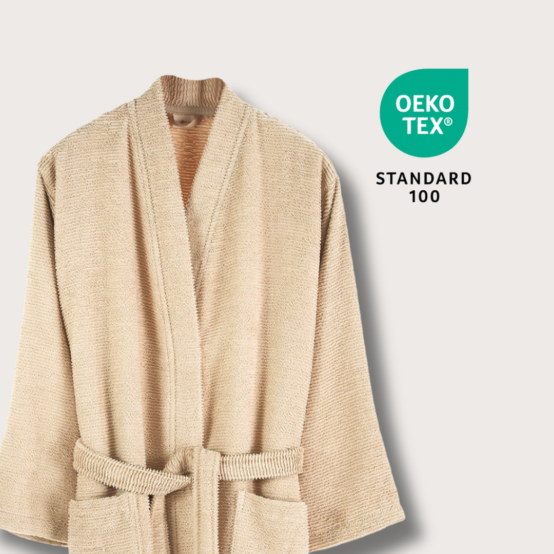 Beige robe with Oeko-Tex Standard 100 logo on a light gray background