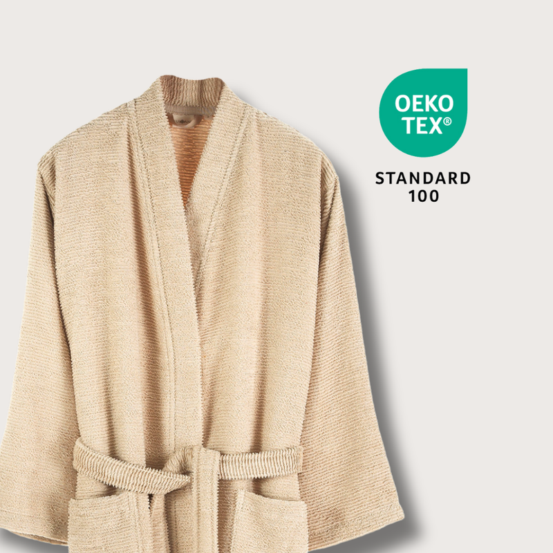 Beige robe with Oeko-Tex Standard 100 logo on a light gray background
